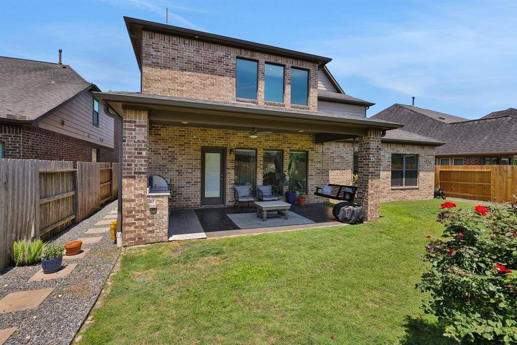 This beautiful backyard also features two side yards for additional space!