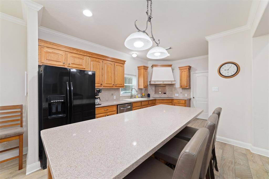 Kitchen with huge island with breakfast bar.