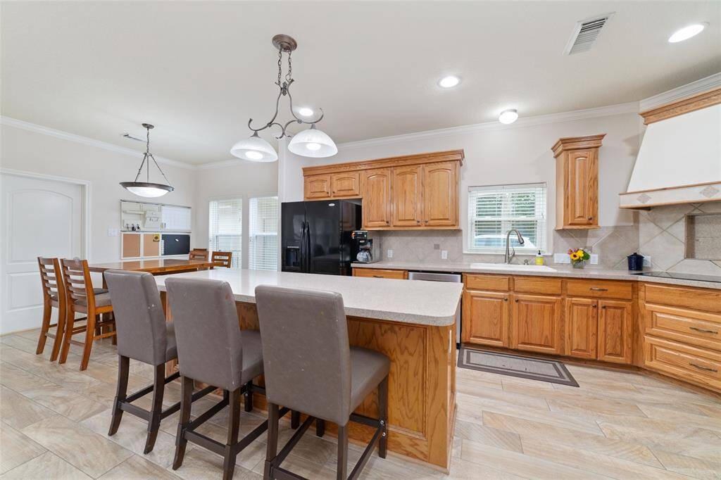 Kitchen with huge island with breakfast bar.