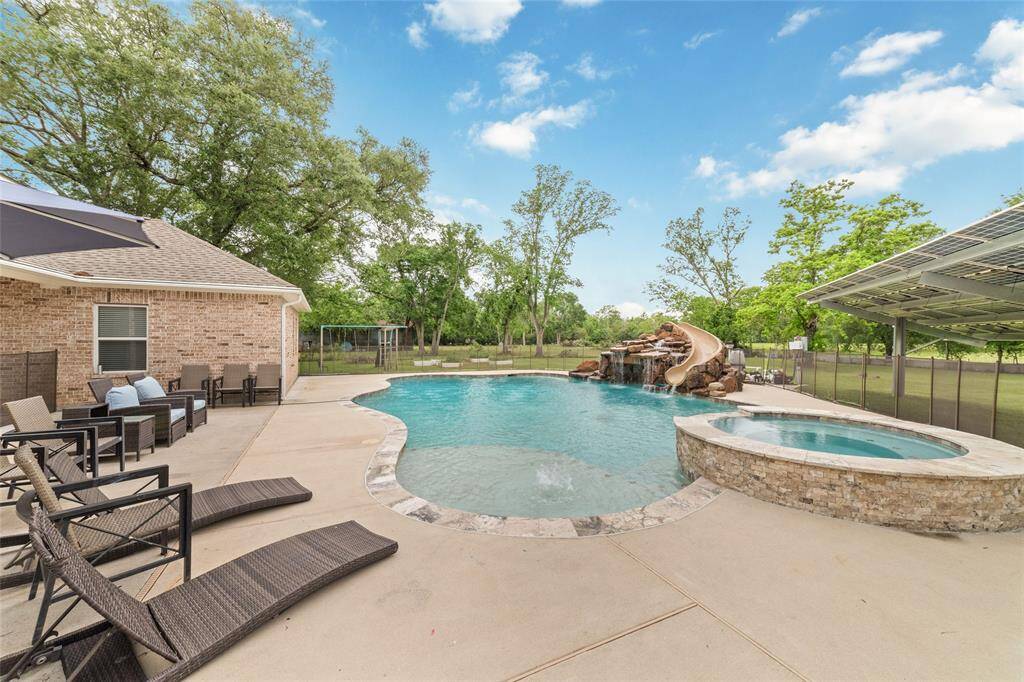 Tucked away on 1.5 serene acres in Manvel, this distinctive property is built for the way you want to live. The flexible floorpan allows between 4 to 6 bedrooms, 2.5 baths, a 2-car garage, in-ground pool, plus a 60'x30' insulated shop.