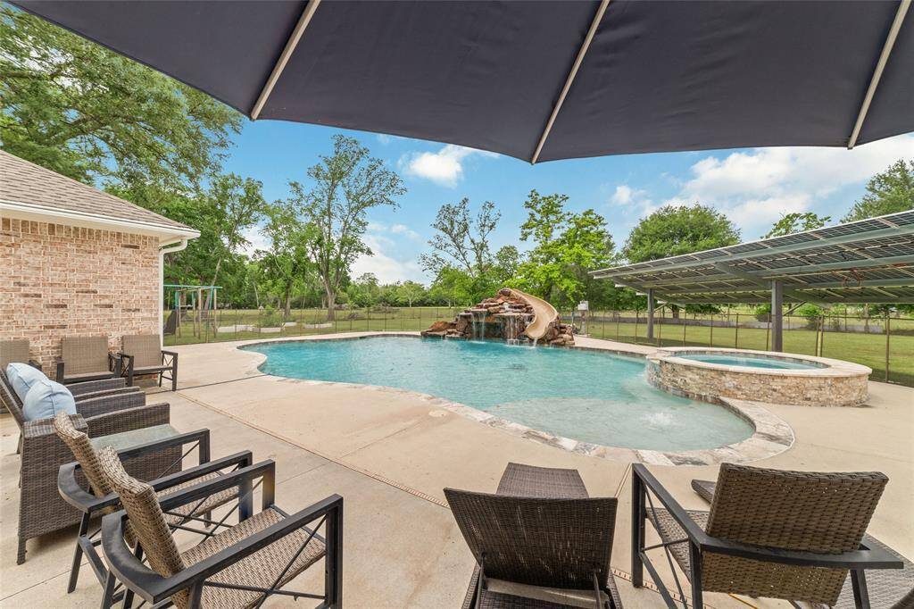 Tucked away on 1.5 serene acres in Manvel, this distinctive property is built for the way you want to live. The flexible floorpan allows between 4 to 6 bedrooms, 2.5 baths, a 2-car garage, in-ground pool, plus a 60'x30' insulated shop.