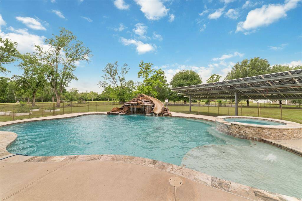 Tucked away on 1.5 serene acres in Manvel, this distinctive property is built for the way you want to live. The flexible floorpan allows between 4 to 6 bedrooms, 2.5 baths, a 2-car garage, in-ground pool, plus a 60'x30' insulated shop.