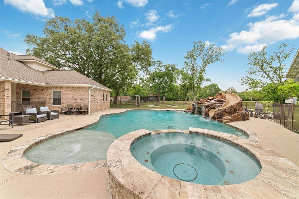 Tucked away on 1.5 serene acres in Manvel, this distinctive property is built for the way you want to live. The flexible floorpan allows between 4 to 6 bedrooms, 2.5 baths, a 2-car garage, in-ground pool, plus a 60'x30' insulated shop.