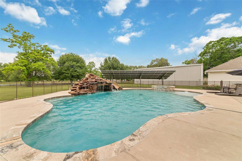 Tucked away on 1.5 serene acres in Manvel, this distinctive property is built for the way you want to live. The flexible floorpan allows between 4 to 6 bedrooms, 2.5 baths, a 2-car garage, in-ground pool, plus a 60'x30' insulated shop.