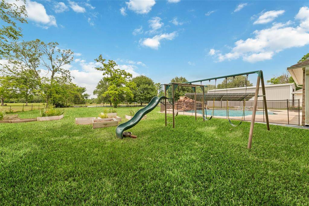 Tucked away on 1.5 serene acres in Manvel, this distinctive property is built for the way you want to live. The flexible floorpan allows between 4 to 6 bedrooms, 2.5 baths, a 2-car garage, in-ground pool, plus a 60'x30' insulated shop.