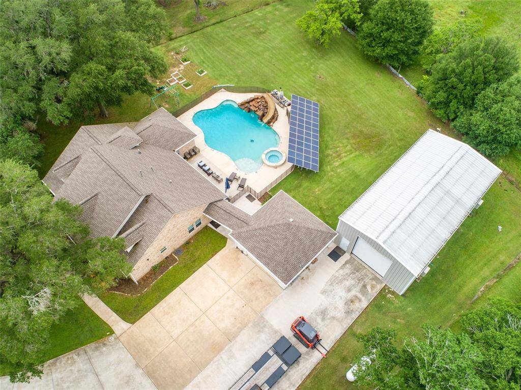 Tucked away on 1.5 serene acres in Manvel, this distinctive property is built for the way you want to live. The flexible floorpan allows between 4 to 6 bedrooms, 2.5 baths, a 2-car garage, in-ground pool, plus a 60'x30' insulated shop.
