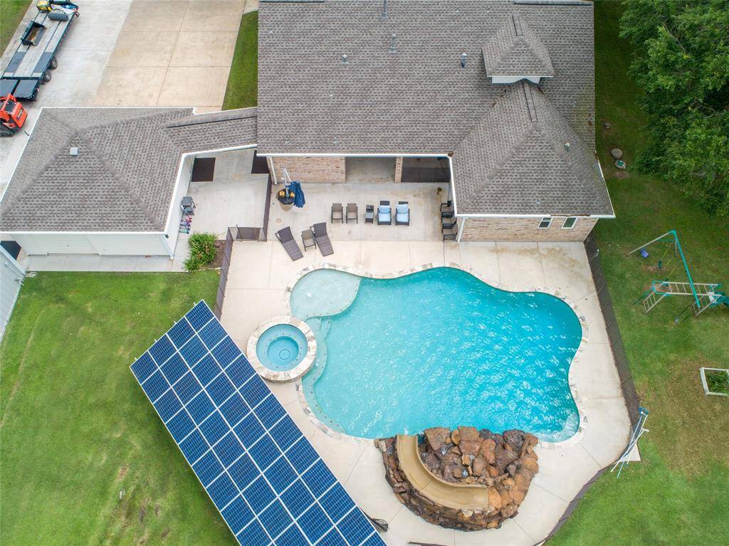 Tucked away on 1.5 serene acres in Manvel, this distinctive property is built for the way you want to live. The flexible floorpan allows between 4 to 6 bedrooms, 2.5 baths, a 2-car garage, in-ground pool, plus a 60'x30' insulated shop.
