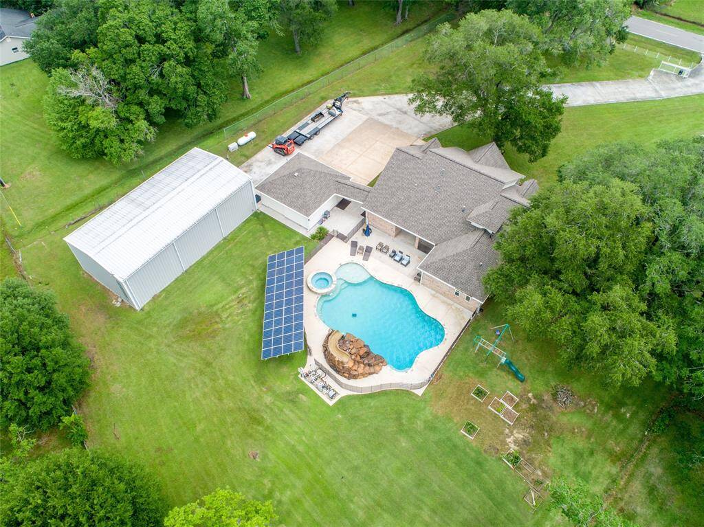 Tucked away on 1.5 serene acres in Manvel, this distinctive property is built for the way you want to live. The flexible floorpan allows between 4 to 6 bedrooms, 2.5 baths, a 2-car garage, in-ground pool, plus a 60'x30' insulated shop.