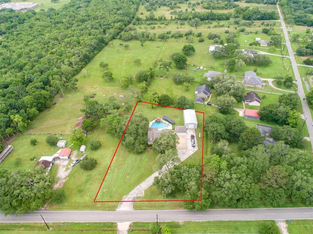 Tucked away on 1.5 serene acres in Manvel, this distinctive property is built for the way you want to live. The flexible floorpan allows between 4 to 6 bedrooms, 2.5 baths, a 2-car garage, in-ground pool, plus a 60'x30' insulated shop.