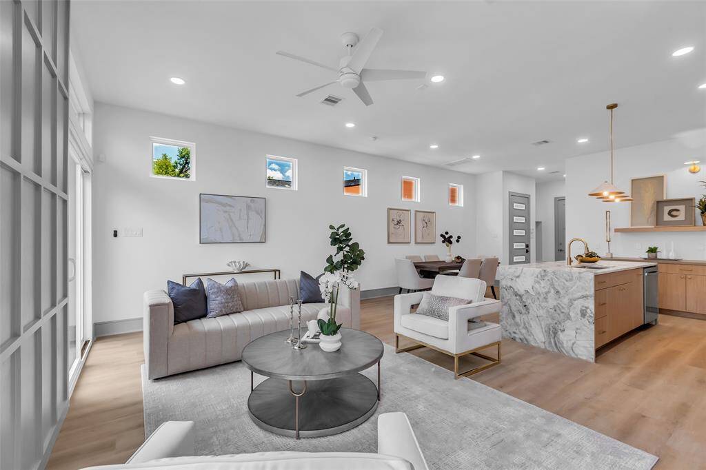 A view from another corner of the living room, with the dining area in the background.