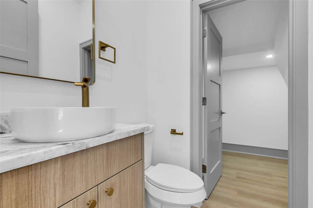 A convenient half bath located on the first floor with additional storage for easy access.