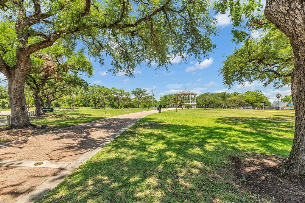 A view of the community grounds, surrounded by mature trees for a natural setting.