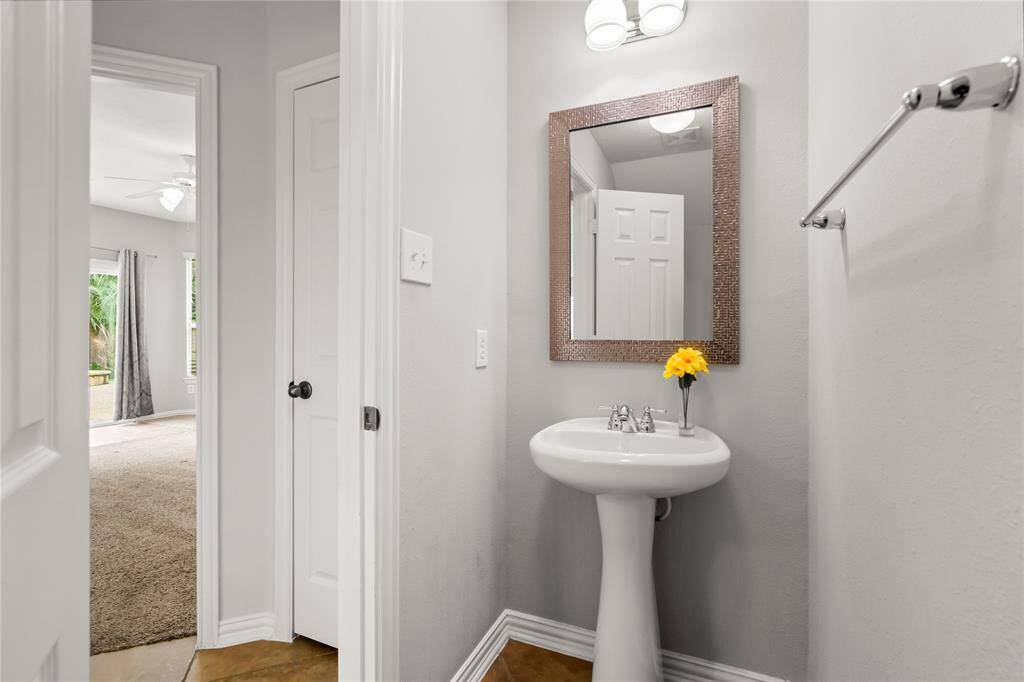Half bath conveniently located at the center of first floor