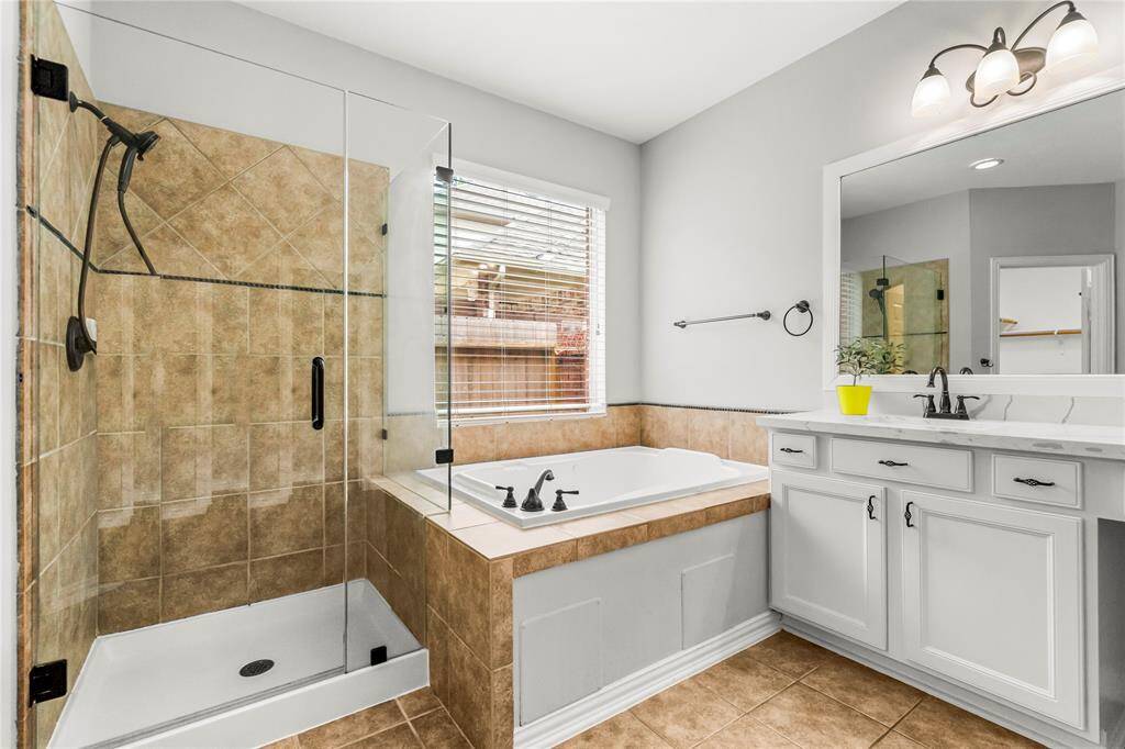 Soak away stress in the jacuzzi or freshen up in the frameless shower