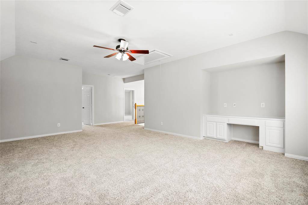 Oversized gameroom upstairs with built in cabinets