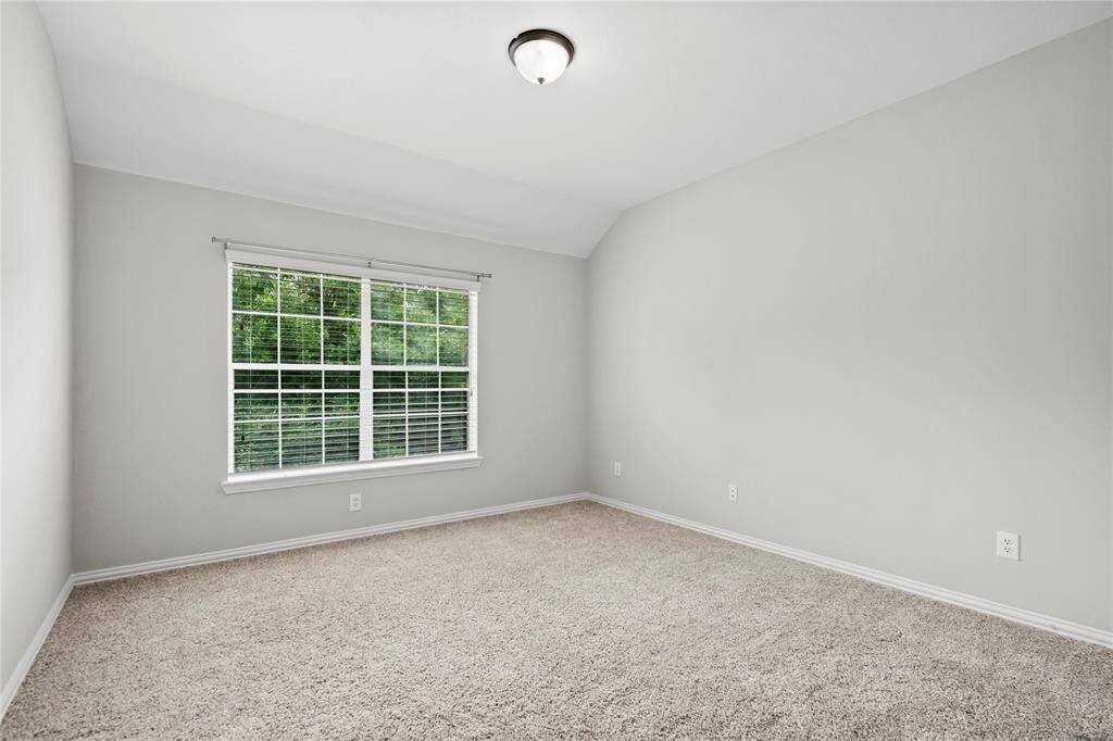 Roomy secondary bedroom high ceiling