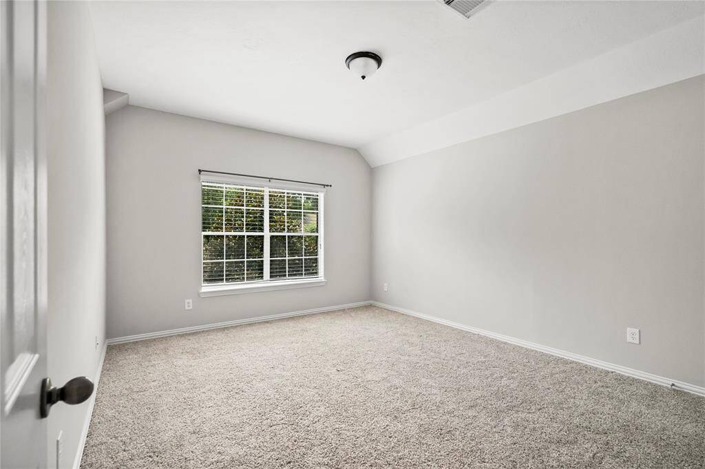 Roomy secondary bedroom high ceiling