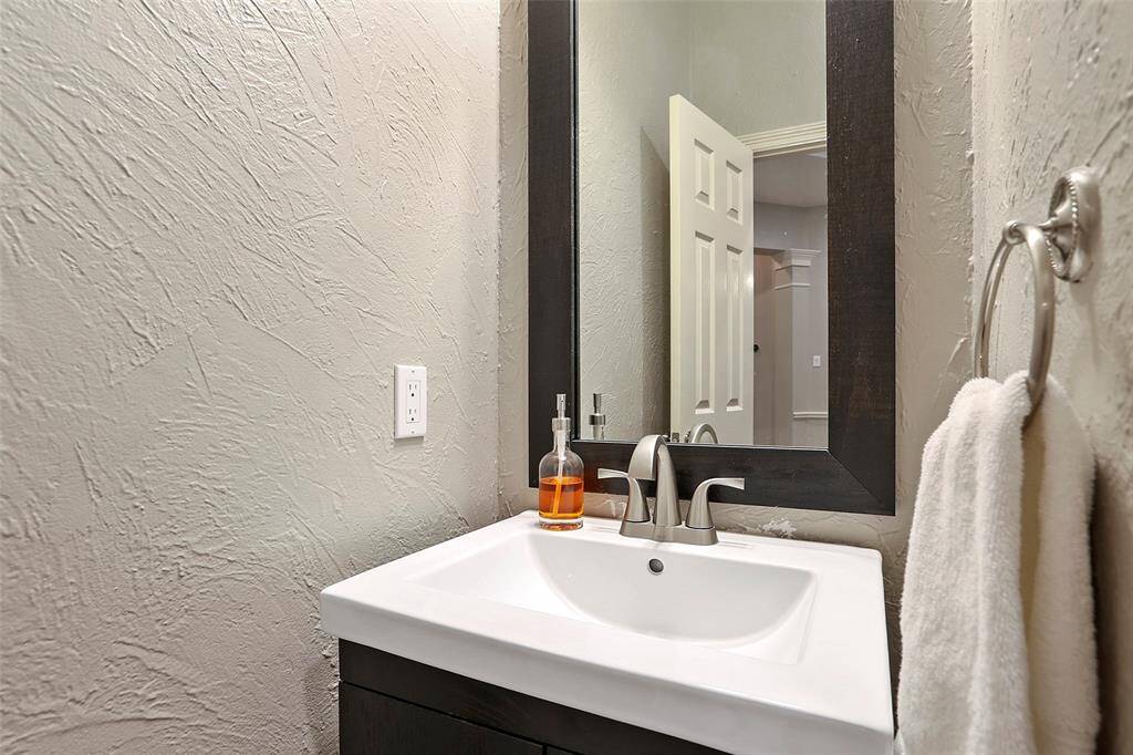 The half bath for guests is located off of the main hall.