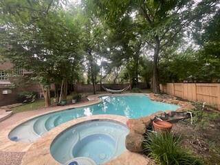 A view of the expansive back yard and the newly updated pool and spa!