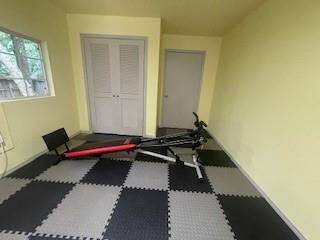 Two pieces of gym equipment and a mini-fridge are included in the rental.