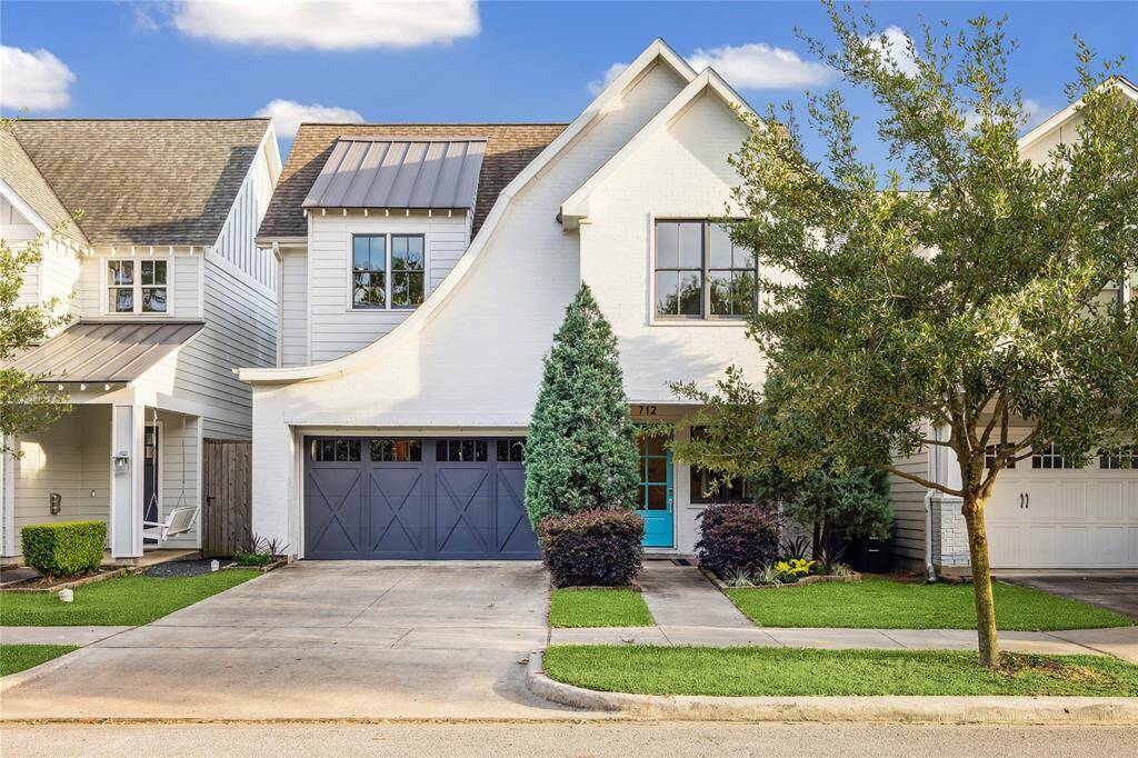 Welcome to 712 E 14th Street where thoughtful design and graceful lines create lasting curb appeal.