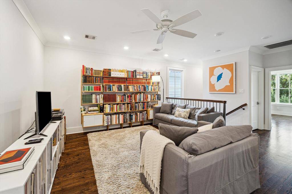 As you make your way upstairs, you're greeted by a spacious family room - an ideal spot to unwind, read or gather for movie nights.