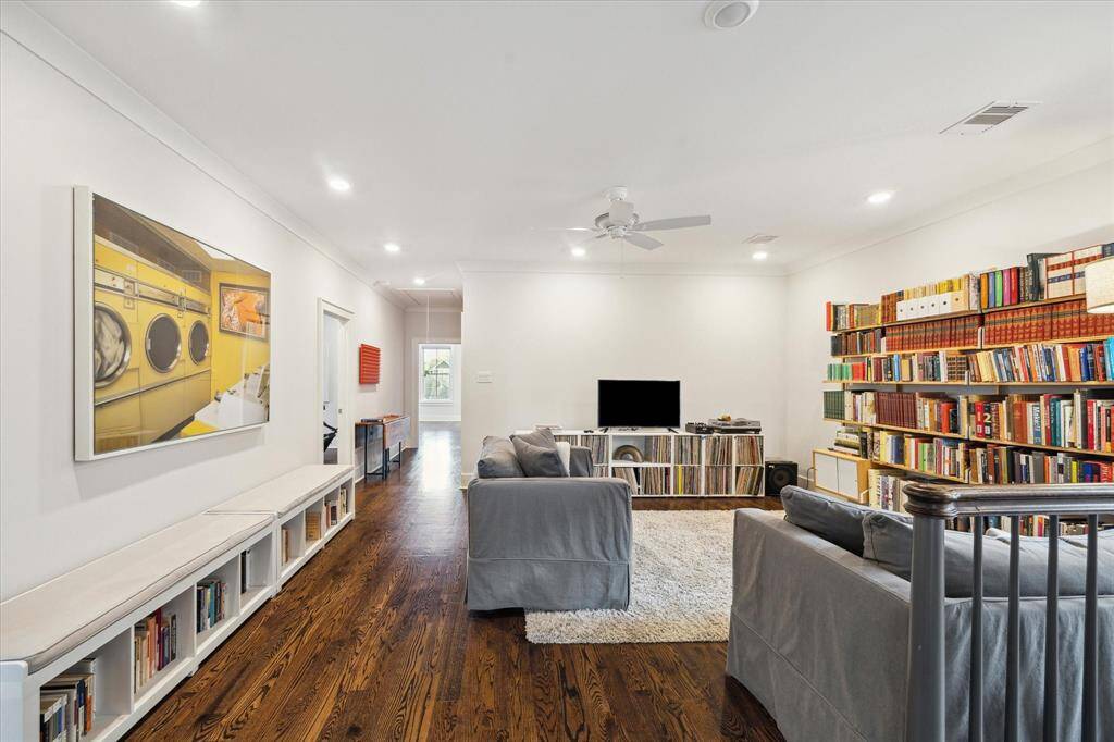 The upstairs retreat is framed by generous wall space - perfect for displaying art or adding bookshelves