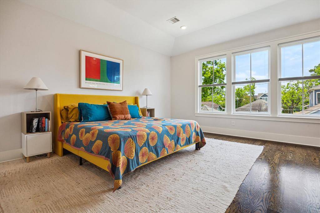 The primary suite offers a spacious layout with a long hallway entry - creating a sense of privacy and calm, while offering space for art, seating or a quiet reading corner.