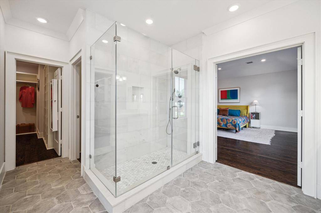 Just around the corner from shower, you'll find two expansive walk-in closets offering exceptional storage.