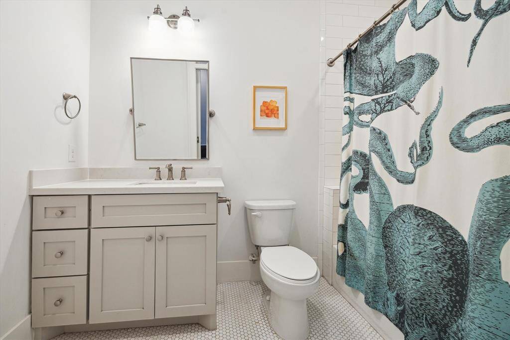 Third ensuite bath also has a tub and shower combination