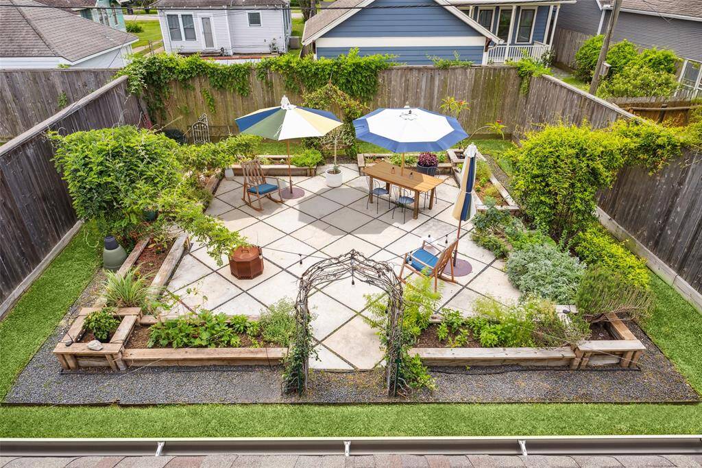 This expansive 30x46 ft yard is a gardener's dream, filled with native plants and thriving herbs, and still offers plenty of room to add a pool if desired.