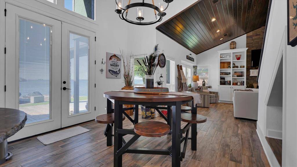 The dining area is conveniently located between the kitchen and living area with the best view in the house. After dinner, step out onto the patio and enjoy the lake breeze.