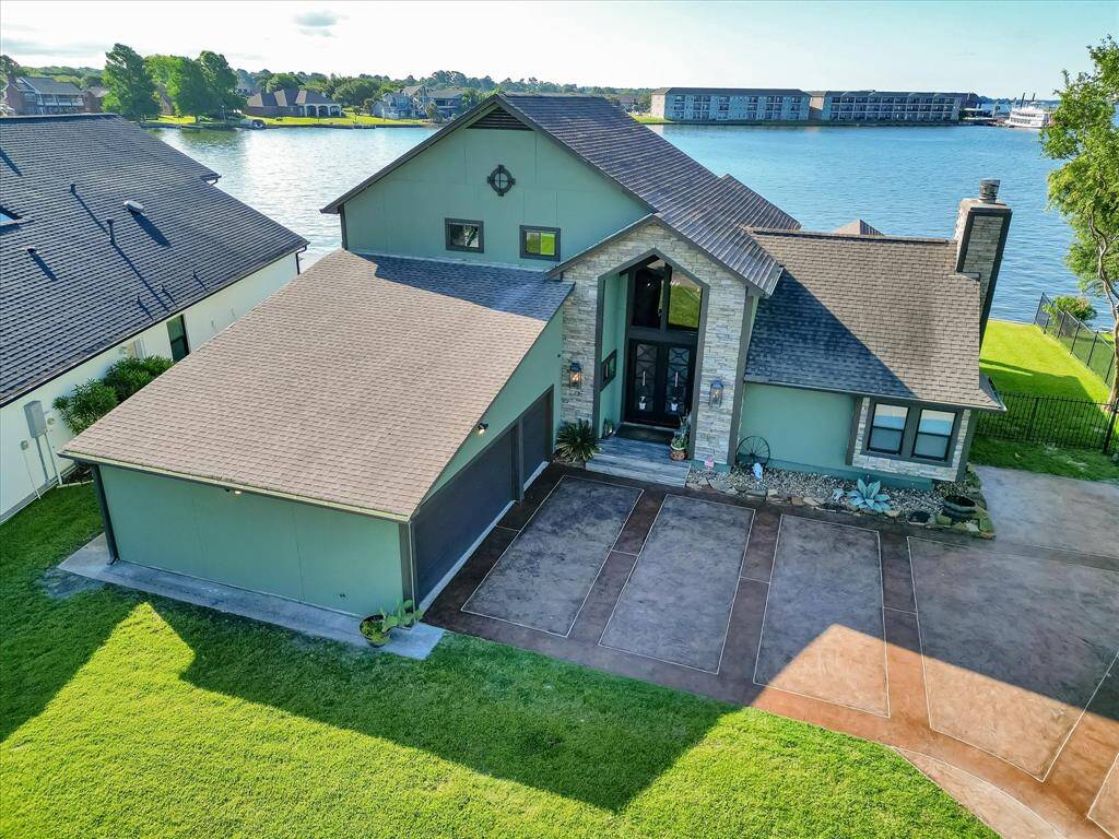 Lakefront luxury with watercraft fun! Perfect for entertaining and serene living.