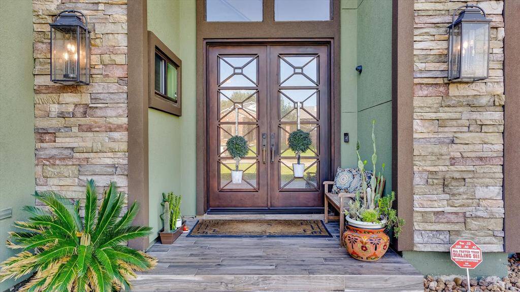 As you step up to this inviting entrance, you set the tone for the elegance you will experience throughout the home.