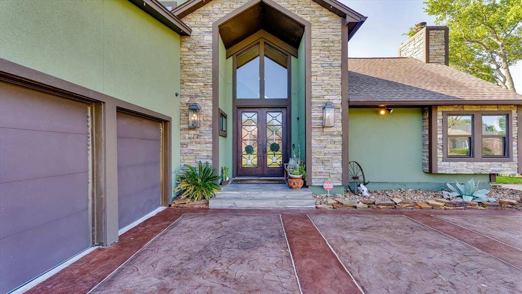 This stunning entrance, framed with rustic stone invites you into a haven of luxury and style. With a spacious layout and inviting design, it's perfect for entertaining or relaxing. Ready to make every day feel like a getaway?