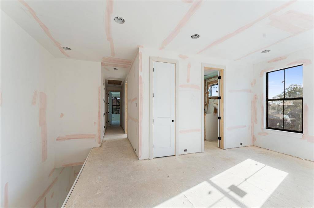 Another view of the game room/optional 4th bed and hallway that leads to bedroom 3. *Photos taken in mid-March.*