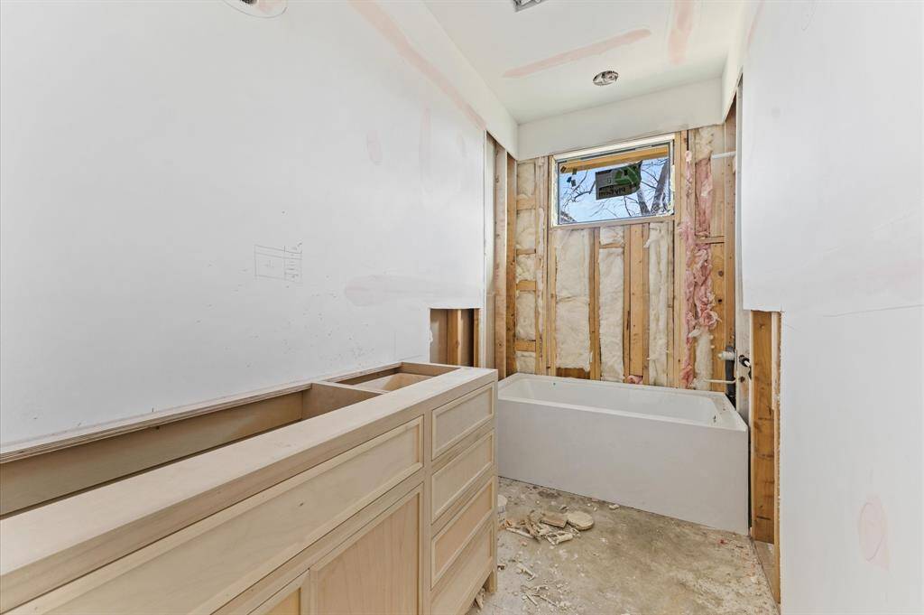 Bath 3 has quartz countertops, custom inset cabinets and alcove tub/shower combo.
