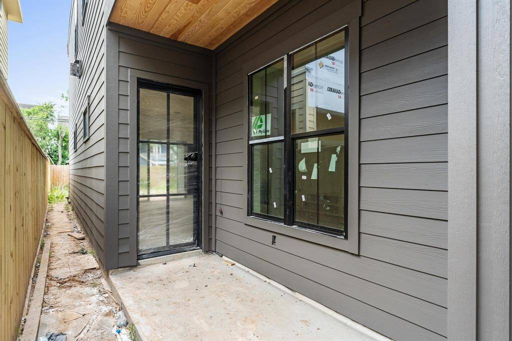 Covered walkway leads to front porch. *Photo taken in late April*