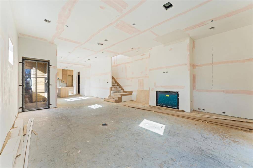 Spacious living area leads to the dining room and gourmet kitchen. *Photo taken in mid-March*