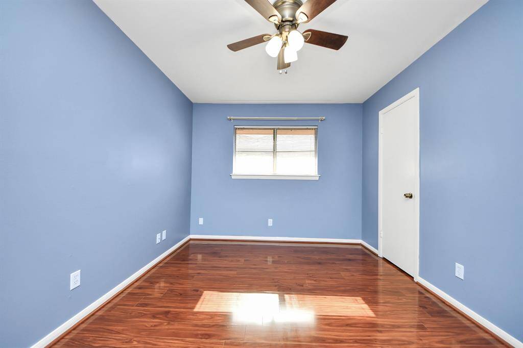 Comfortable and bright, this second bedroom includes a ceiling fan, generous closet space, and a welcoming atmosphere—ideal for relaxation or productivity.