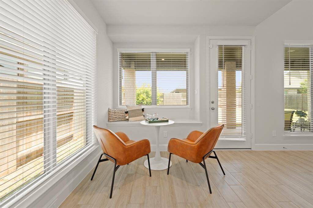 Start your day off right with a cup of coffee sitting with your family in the breakfast area! Featuring large windows, neutral paint, beautiful flooring, recessed lighting, and access to the covered back patio!