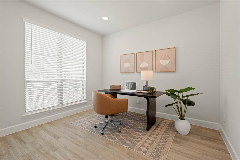 Nestled away quietly in the front of the home is the home office! Featuring high ceilings, recessed lighting, French doors, and large windows, this is the ideal space to work from home!
