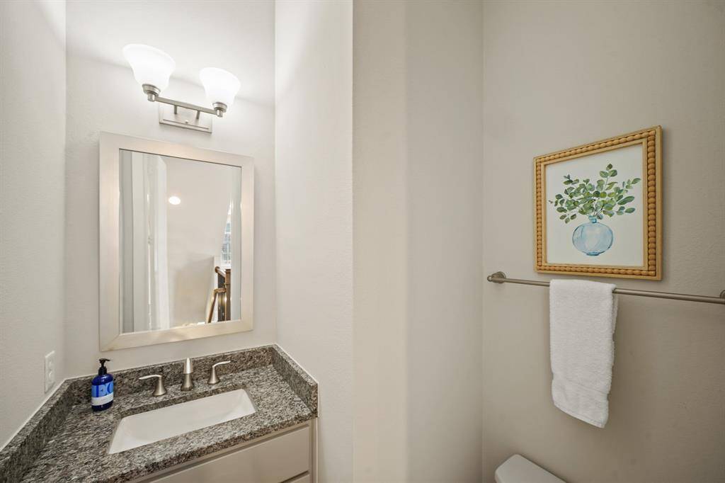 Half Bath: Off open living space.
