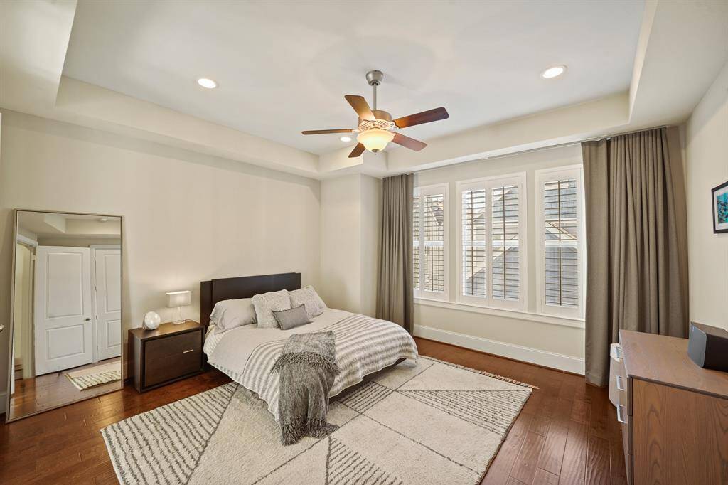Primary Bedroom: Spacious primary suite offering a large walk-in closet and blackout shades for enhanced comfort.
