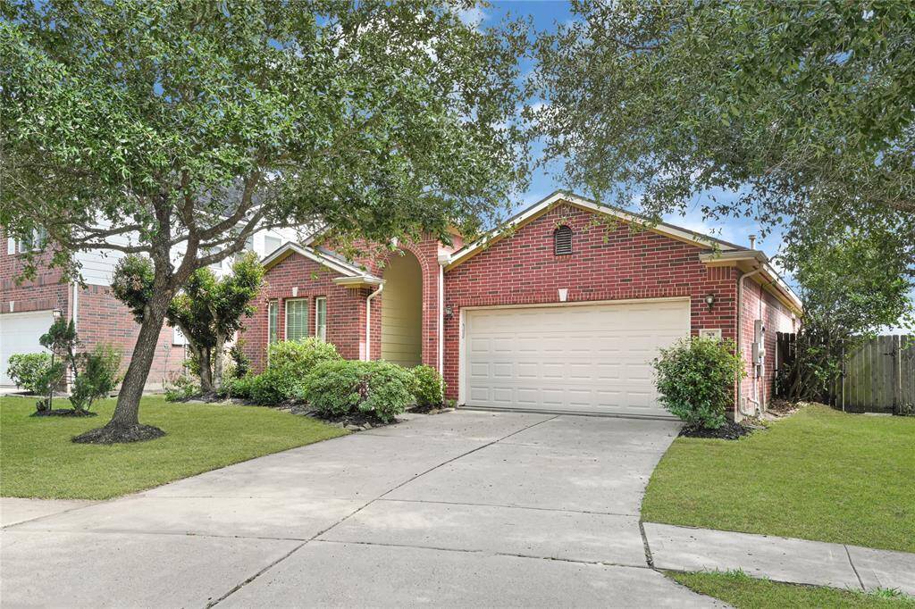 Located on a quiet street with a beautifully maintained front yard.