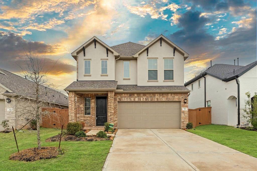 This home greets you with a wide driveway, offering ample parking space for guests or multiple vehicles.