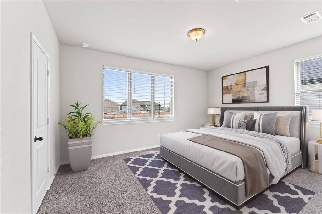 Spacious and serene, the master bedroom offers a relaxing retreat at the end of the day.Wide windows fill the room with soft, natural light, enhancing its cozy ambiance.