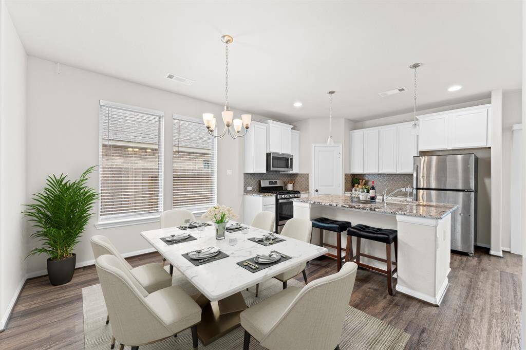 The adjacent dining area offers a warm space for family meals and gatherings.
