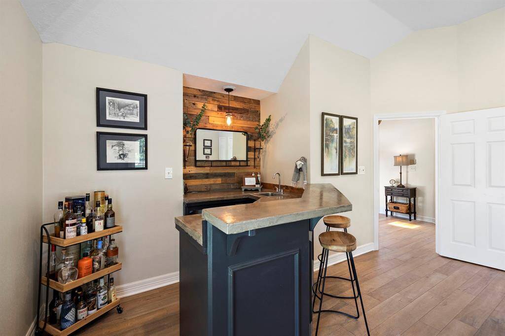 The game room is complete with a bar perfect for entertaining or a movie night in.