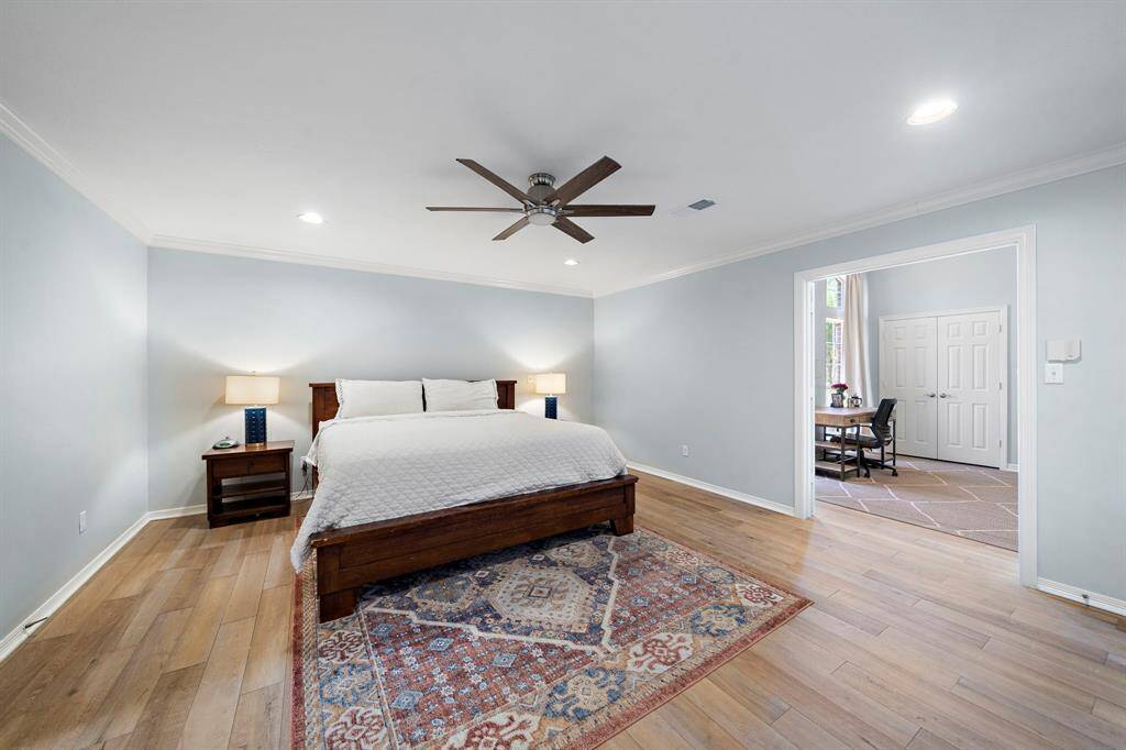 This bright, spacious room features elegant finishes and ample natural light, while French doors open to a versatile flex space, perfect for a private study, cozy reading nook, or an additional bedroom—tailored to your needs.